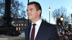 Ex-top official Robbins reaches settlement with government over sacking