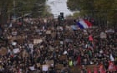 Hundreds of thousands march across France in protests over schools and policing