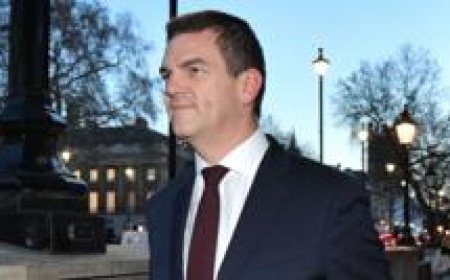 Ex-top official Robbins reaches settlement with government over sacking
